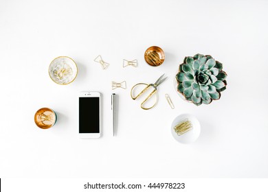 Feminini Desk Workspace With Succulent, Phone, Scissors And Golden Clips On White Background. Flat Lay, Top View