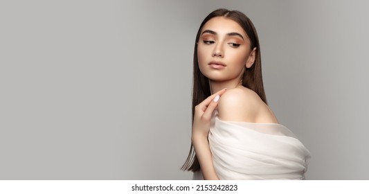 Femininity. Portrait Of Tender Young Woman Covered With White Veil Isolated Over Grey Background. Concept Of Skin Care, Cosmetology, Spa, Plastic Surgery, Beauty Treatment, Naturality, Health