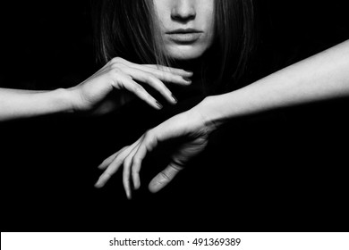 Femme Fatale Concept. Old Classic Movies Actress Style. Close Up Profile Portrait Of Gorgeous Young Woman With Beautiful Hands Over Black Background. Black And White Studio Shot