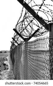 Fence With A Barbed Wire