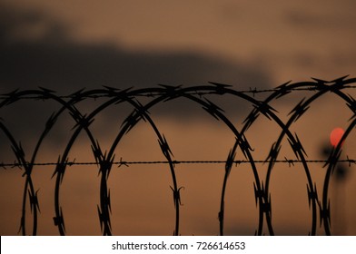 Fence with barbed wire. Barrier, entry ban