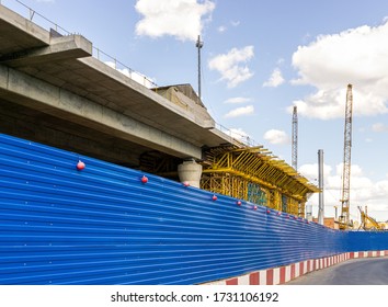 Fence From Blue Corrugated Metal Around Construction Site. Road Construction