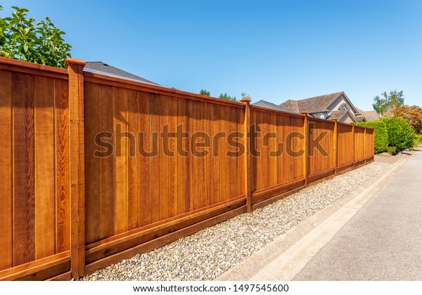 Fence built from wood. Outdoor
landscape. Security and privacy concept. Vancouver.
Canada.