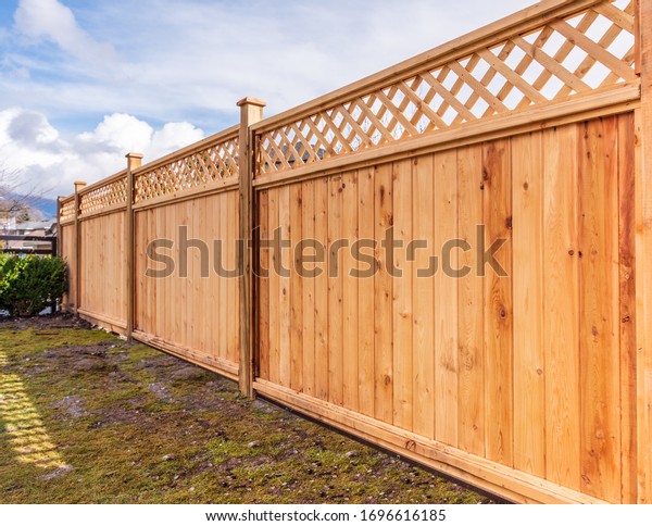 Fence built from wood. Outdoor
landscape. Security and privacy concept. Vancouver.
Canada.