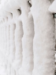 Fence Covered With Heavy Snow. Minimalism With Snowy Fence. Abstract Background With Snowy Fence. 