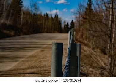 Fence down an old road
