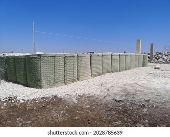 Fence with hesco bastion type in the insecure area - Shutterstock ID 2028785639