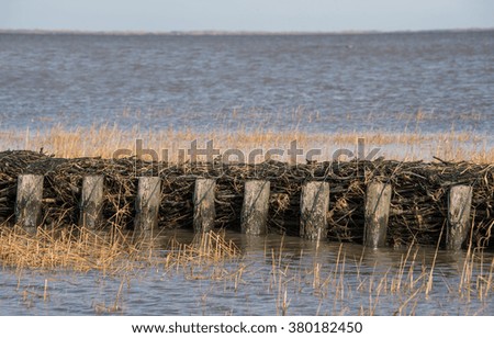 Similar – Lahnungen coastline barge