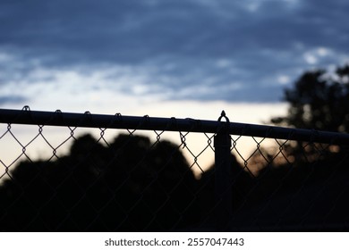 fence with sunset in the background