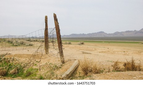 A Fenced For An Watering Hole On The Dry Lake Bed In Ivanpah Valley.