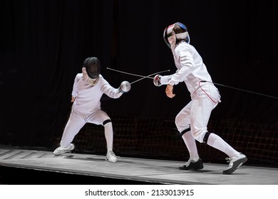 Fencer  With Fencing Sword. Fencers Duel Concept
