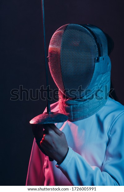 Fencer\
woman with fencing epee saber sword. Color\
light.