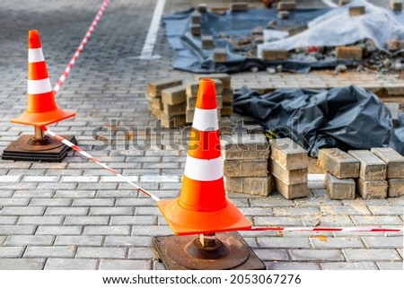 Fencing of the dangerous zone of the road where repair work is being carried out. Unauthorized access to the site with construction and installation work is prohibited. Compliance with safety rules