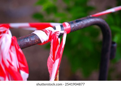 Fencing fields, government offices, or restricted areas with brightly colored plastic ropes to make them clearly visible. Restricted areas, disease or danger prevention, plant breeding areas. - Powered by Shutterstock