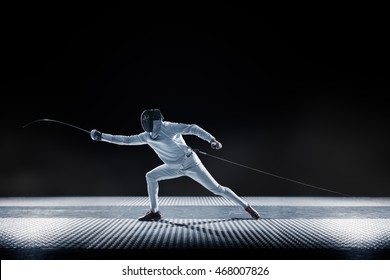 Fencing Player Isolated On The Black Background