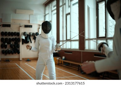 Fencing sport. Two girl fencers training in hall. - Powered by Shutterstock