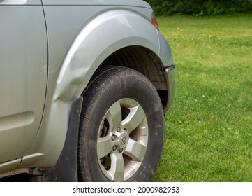 A Fender Bender Accident Left Minor Damage To The Passenger Side Of This Silver Colored Pickup Truck. Bokeh Effect.