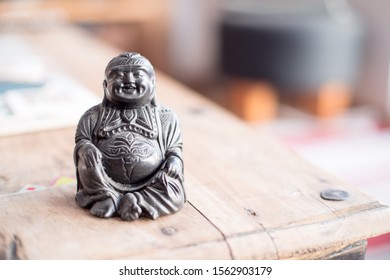 Feng Shui: Buddha Statue At On A Table In The Own Living Room. 