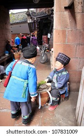 FENGHUANG - MARCH 23: Miao Women Wear A Traditional Dress On March 23, 2012 In Fenghuang, China. According To The 2000 Census, The Number Of Miao In China Was Estimated To Be About 9.6 Million.