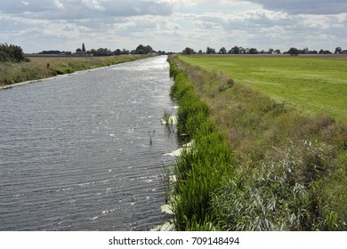 Fenland Drainage Channel And Agricultural Landscape At Sixteen Foot Bank Near March In Cambridgeshire, UK.