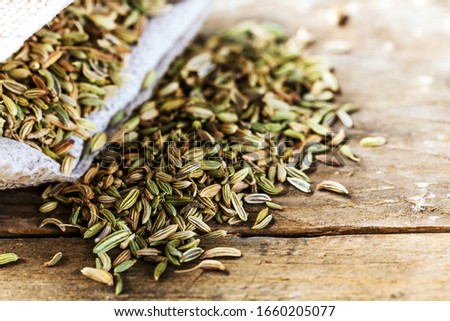 Fennel seeds on wooden table