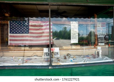 Ferguson, Missouri, USA, June 20, 2020 - American Flag And I Love Ferguson Sign In Small Business Window. Small Town America, National Pride, Patriotism, Family Owned Business