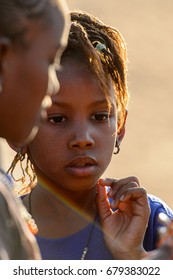 FERLO DESERT, SENEGAL - APR 25, 2017: Unidentified Fulani Little Girl With Braids Wears Earings. Fulanis (Peul) Are The Largest Tribe In West African Savannahs