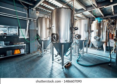 Fermentation mash vats or boiler tanks in a brewery factory. Brewery plant interior.  - Powered by Shutterstock