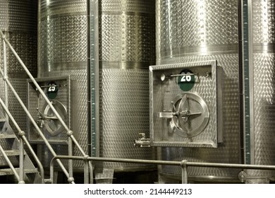 Fermentation In Progress. Tankers For Fermenting Wine Inside A Wine Factory.