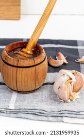 Fermented Garlic Cloves Honey, A Rich Source Of Probiotics, White Background. Vertical Photo