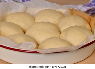 Fermented Milk Buns In Baking Pan; Delicious, Fluffy Rolls With Milk Bread Dough Ready To Bake On Wooden Table