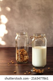 Fermented Milk Product Kefir In A Glass Jar With Granola On A Beige Background