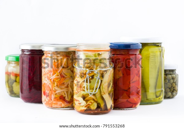 Fermented preserved vegetables in jar isolated on white background
