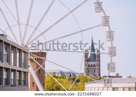 Ferris wheel in Cologne, Germany with a view of the main architectural sights of the city - towers, churches and houses