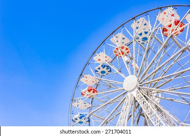 Ferris Wheel At The County Fair With The Sky In The Background