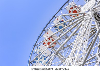 Ferris Wheel At The County Fair With The Sky In The Background