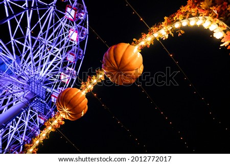 Ferris wheel and halloween decorations in Tivoli, Aarhus.
