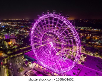 Ferris Wheel illuminated at night - Shutterstock ID 1568601652