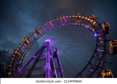 Ferris Wheel With Light Between Clouds. London Eye. Winter. Night Sky And Clouds. England. Great Britain 