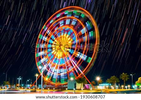 Ferris wheel at night in Batumi, Georgia (long exposure with star trails in the night sky)