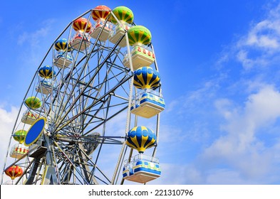 Ferris wheel on the background of blue sky - Powered by Shutterstock