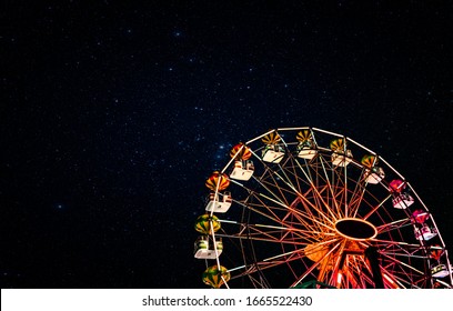 Ferris wheel on a background of the starry night sky