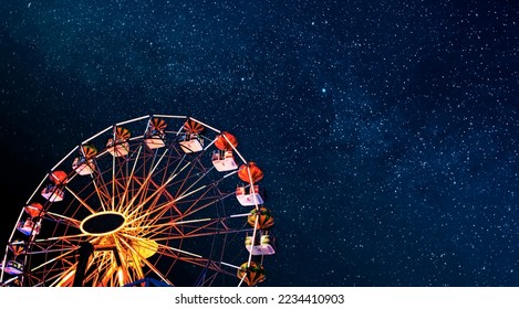 Ferris wheel on a background of the starry night sky