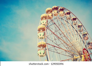 Ferris Wheel Over Blue Sky - Shutterstock ID 129050396
