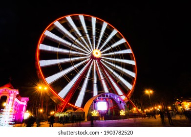 Ferris Wheel In The Park In The Evening.