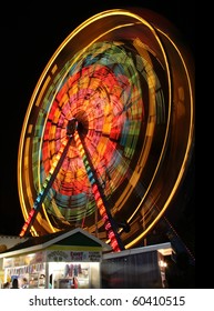 Ferris Wheel Spinning At Night.