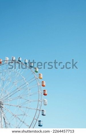 Ferris wheel under the blue sky