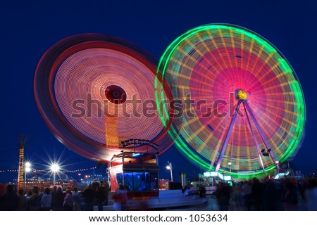 Ferris-wheels at night with blue sky