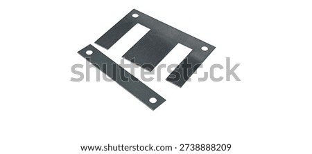 Ferrite core for transformers on a white background.