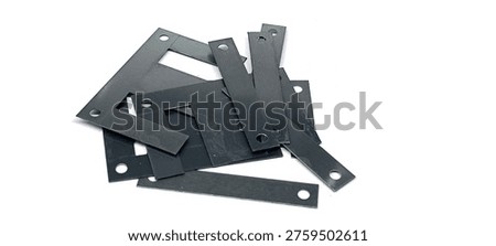 Ferrite core for transformers on a white background.
